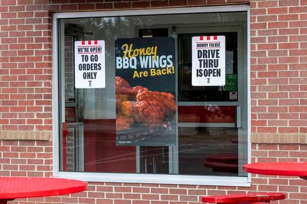 Sign in the window of a KFC fast food restaurant telling customers only the drive thru is open for to go orders because of the coronavirus epidemic, Vadnais Heights, Minnesota. ÂMichaelxSilukx xUniversalxImagesxGroup ms_8514.jpg 64393_02_ms_8514