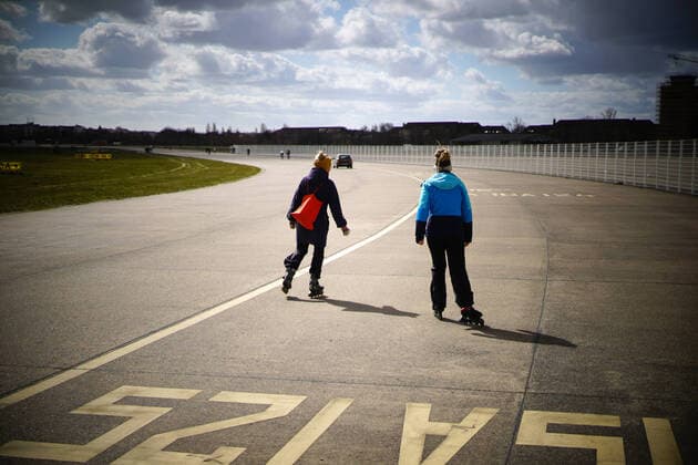 03 04 2020,Berlin,Germany,GER,the city in times of the Corona Pandemic,two women are on the road with skaters Tempelhof Feld
