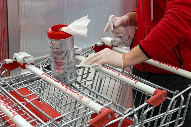 Hanover , from Saturday 04 04 2020, the DIY stores open again, preparations for the rush, disinfection, disinfect, disinfect shopping trolleys,