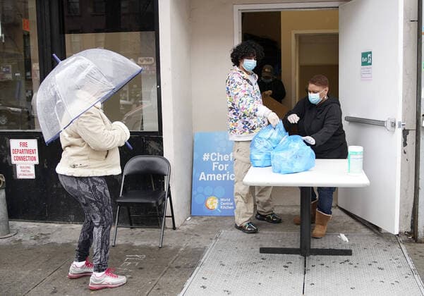 World Central Kitchen workers pass out lunches to residents in the Harlem section of New York City on Friday, April 3, 2020. The Coronavirus deaths have doubled in the past 3 days to almost 3,000 deaths.  NYP20200403106 JOHNxANGELILLO