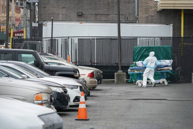 April 3, 2020, New York, NY, USA: Medical staff move bodies from the Wyckoff Heights Medical Center to a refrigerated truck on April 3, 2020 in the Borough of Brooklyn, New York. - The Federal Emergency Management Agency (FEMA) has asked the US Defense Department for 100,000 body bags as the toll mounts from the novel coronavirus, the Pentagon said on April 2. New York USA - ZUMAb148 20200403_zap_b148_013 Copyright: xBryanxSmithx
