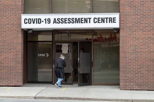 April 3, 2020: A woman enters the COVID-19 assessment centre at Bathurst and Dundas in Toronto. - ZUMAc232 20200403_zip_c232_009 Copyright: xGilesxCampbellx