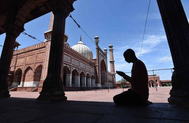 NEW DELHI, INDIA - APRIL 3: A mosque caretaker offers Friday namaz on day ten of the 21 day nationwide lockdown to curb the spread of coronavirus, at Jama Masjid on April 3, 2020 in New Delhi, India. People are asked to offer Friday Namaz from their home as a precautionary measure to curb the spread of coronavirus. (Photo by Ajay Aggarwal Hindustan Times) Empty Mosques On Friday During Three Week Lockdown To Stop Spread Of Coronavirus COVID-19