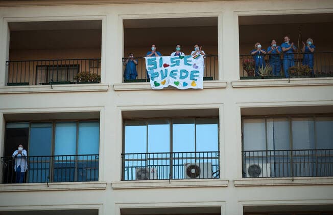 April 3, 2020, Malaga, Spain: Nurses and doctors of the Regional Hospital in downtown retuning the applause (which has become a custom every evening) to those that show gratitude towards during the fight against the Covid-19 virus outbreak..Spain is the first country in Europe with more than 110.000 people infected and almost 11.000 deaths around the country, according to National Health Service sources. Andalusia is the city with more people infected by the virus. Malaga Spain - ZUMAs197 20200403_zaa_s197_259 Copyright: xJesusxMeridax