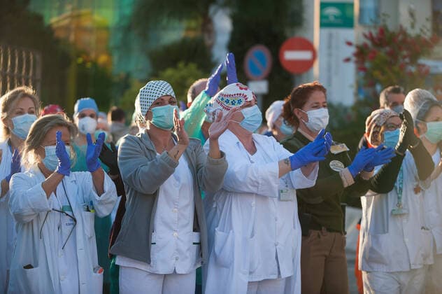 April 3, 2020, Malaga, Spain: Nurses and doctors of the Regional Hospital in downtown retuning the applause (which has become a custom every evening) to those that show gratitude towards during the fight against the Covid-19 virus outbreak..Spain is the first country in Europe with more than 110.000 people infected and almost 11.000 deaths around the country, according to National Health Service sources. Andalusia is the city with more people infected by the virus. Malaga Spain - ZUMAs197 20200403_zaa_s197_300 Copyright: xJesusxMeridax