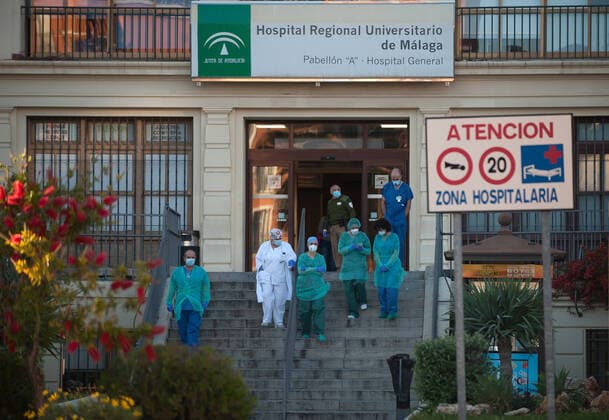 April 3, 2020, Malaga, Spain: Nurses and doctors of the Regional Hospital in downtown retuning the applause (which has become a custom every evening) to those that show gratitude towards during the fight against the Covid-19 virus outbreak..Spain is the first country in Europe with more than 110.000 people infected and almost 11.000 deaths around the country, according to National Health Service sources. Andalusia is the city with more people infected by the virus. Malaga Spain - ZUMAs197 20200403_zaa_s197_310 Copyright: xJesusxMeridax