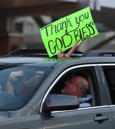 April 3, 2020, Racine, Wisconsin, USA: Hundreds of cars packed the campus of Ascension All Saints Hospital in Racine, Wisconsin Friday April 3, 2020 to show their support to the staff. The event, suggested by a NICU nurse, for cars to parade through the grounds flashing their headlights, was billed as Flashin First Friday because the traditional downtown First Fridays during which stores stay open late was canceled. So many cars came that the parade stalled that most cars just parked facing the hospital buildings and honked their horns for an hour. Racine County reported its first COVID-19 death Friday. Racine USA - ZUMAh154 20200403_znp_h154_014 Copyright: xMarkxHertzbergx