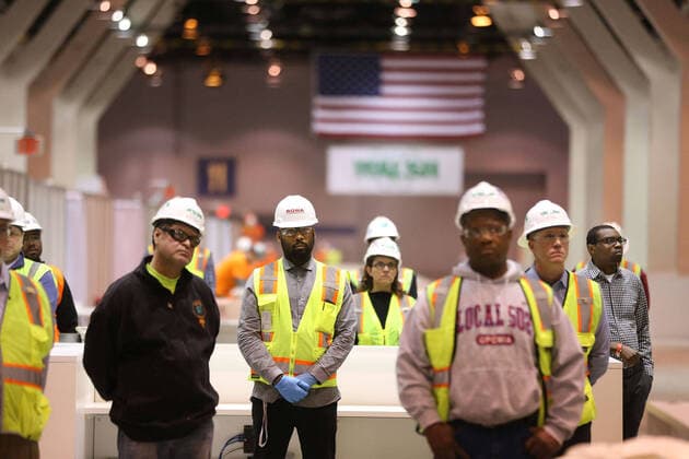 April 3, 2020, Chicago, IL, USA: Construction workers listen in as Illinois Gov. J.B. Pritzker speaks in Hall C Unit 1 of the COVID-19 alternate site at McCormick Place in Chicago on Friday, April 3, 2020. Hall C will house 500 beds. Chicago USA - ZUMAm67_ 20200403_zaf_m67_037 Copyright: xChrisxSwedax