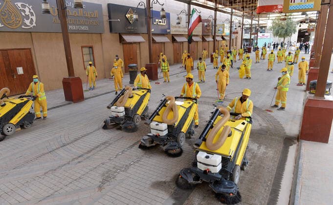 (200403) -- KUWAIT CITY, April 3, 2020 (Xinhua) -- Workers disinfect a street in Kuwait City, Kuwait, on April 3, 2020. Kuwait reported on Friday 75 new COVID-19 cases, bringing the total number in the country to 417, the Health Ministry said in a statement. (Photo by Asad Xinhua) KUWAIT-KUWAIT CITY-COVID-19-DISINFECTION 