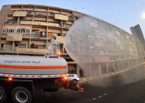 (200404) -- BEIJING, April 4, 2020 -- A truck disinfects a street in Kuwait City, Kuwait, on April 3, 2020. (Photo by Xinhua) XINHUA PHOTOS OF THE DAY Asad 