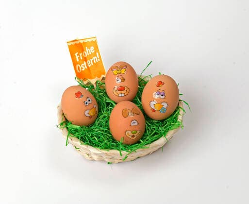 04 04 2020, Symbol picture Easter 2020, Curious bunny rabbit stickers on chicken eggs in the Easter nest 04 04 2020, Easter 04 04 2020, Easter