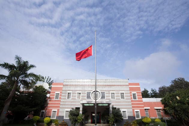 (200404) -- NAIROBI, April 4, 2020 -- A Chinese national flag flies at half-mast to mourn for martyrs who died in the fight against the novel coronavirus disease (COVID-19) outbreak and compatriots who died of the disease at the Chinese Embassy to Kenya in Nairobi, Kenya, April 4, 2020. (Photo by Xinhua) KENYA-NAIROBI-COVID-19-CHINESE EMBASSY-NATIONAL FLAG-HALF-MAST LiuxYang 