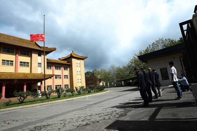 (200404) -- CANBERRA, April 4, 2020 -- A Chinese national flag flies at half-mast to mourn for martyrs who died in the fight against the novel coronavirus disease (COVID-19) outbreak and compatriots who died of the disease at the Chinese Embassy to Australia in Canberra, Australia, April 4, 2020. (Photo by Xinhua) AUSTRALIA-CANBERRA-COVID-19-CHINESE EMBASSY-NATIONAL FLAG-HALF-MAST ChuxChen 