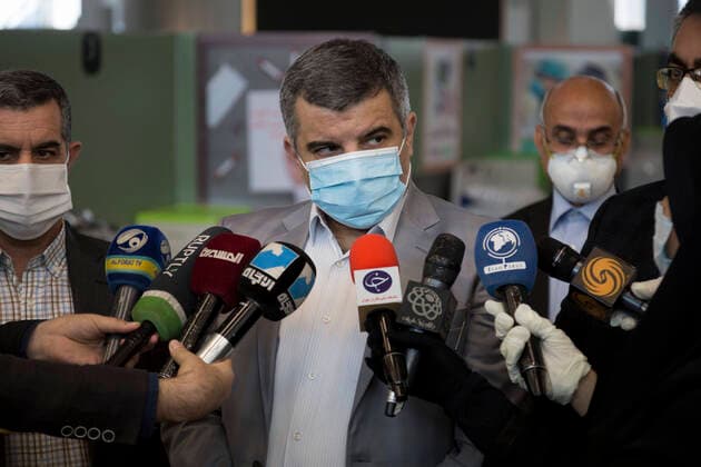 April 4, 2020, Tehran, Iran: Iran s Deputy Health Minister, IRAJ HARIRCHI (C), wearing face mask speaks to media during a visit the temporary established emergency hospital in a part of the world s largest shopping mall complex called Iran Mall , to treat patients infected with the COVID-19 disease, caused by the SARS-CoV-2 coronavirus, in the northwest of the capital of Tehran, Iran. Due to the new type of coronavirus pandemic, the fairgrounds and gyms are temporarily turned into hospitals in the country. Iran Mall has turned into COVID-19 convalescent care center since the virus outbreak, equipped with about 1000 hospital beds, 20 ventilators, monitoring systems, and other needed equipment. Each day the center hosts 20 recovered ones who discharged from hospitals, and the patients are kept in the second round of quarantine to be up - ZUMAf146 20200404_zip_f146_053 Copyright: xRouzbehxFouladix