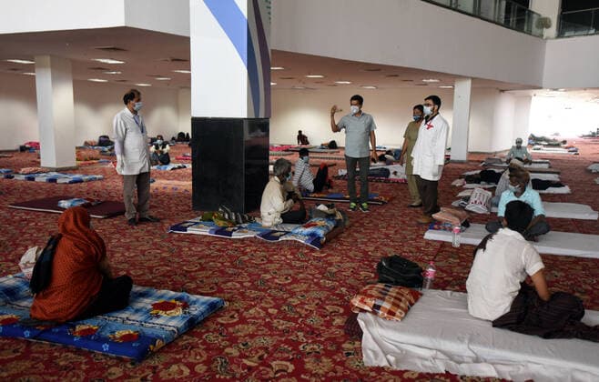 NEW DELHI, INDIA APRIL 4: Medical staff on duty attending to migrant workers and the homeless at a temporary shelter, on day eleven of the nationwide lockdown to check the spread of coronavirus, at Yamuna Sports Complex, on April 4, 2020 in New Delhi, India. (Photo by Sonu Mehta Hindustan Times ) India Goes Into 21 Day Lockdown Due To Coronavirus COVID 19