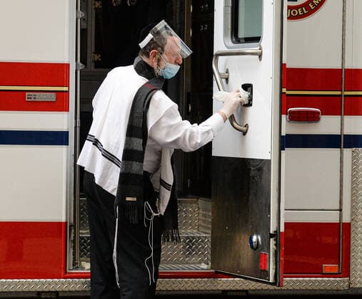 April 4, 2020, New Yok Manhattan: Hasidic Jewish EMT volunteer decontaminating the coronavirus ambulance after leaving the patient in the hospital. 04 04 20 New York Manhattan Mount Sinai Hospital. New Yok Manhattan - ZUMAs252 20200404_znp_s252_004 Copyright: xMarcusxSantosx