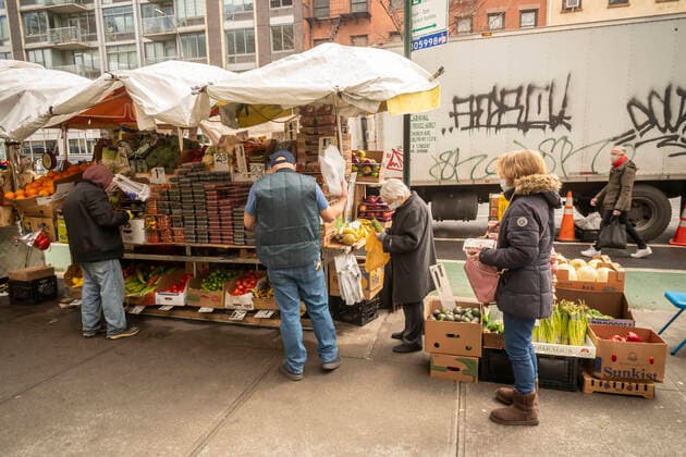 New York during the COVID-19 pandemic Customers line up at a fruit stand in the Chelsea neighborhood of New York on Saturday, April 4, 2020. (  RichardxB.xLevine