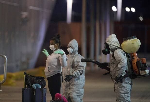 A woman who was on board the Marella Discovery 2 cruise ship is disinfected after the docking of the ship was authorized for humanitarian reasons for the disembarkation of 32 members of his crew who are Dominican citizens, and who asked to return to the country instead of continuing the sailing trip to Europe, this Saturday in Santo Domingo, Dominican Republic 4 April 2020. The 32 people will be transferred directly to a quarantined social isolation center, in order to comply with the Protocol established by the Ministry of Public Health. The number of deaths in the Dominican Republic from the coronavirus rose to 77 people, while 1,578 are infected, as of today. Landing of the Marella Discovery 2 cruise ship for Dominican crew and citizens !ACHTUNG: NUR REDAKTIONELLE NUTZUNG!  Copyright: xOrlandoxBarríax AME295 20200405-637216580725485861