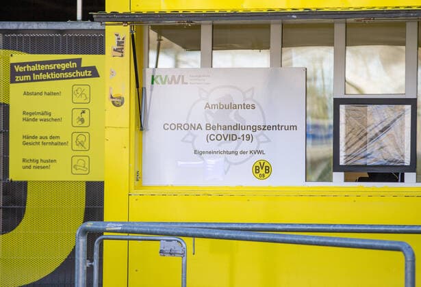 (200405) -- DORTMUND, April 5, 2020 (Xinhua) -- A sign reading COVID-19 testing center is seen outside the COVID-19 testing center at Borussia Dortmund s stadium in Dortmund, Germany, April 4, 2020. Borussia Dortmund s stadium housed a COVID-19 testing center From Saturday. Rooms in the Westfalenstadion s north stand have been prepared to take in people suspected of suffering from COVID-19. It is hoped the center will relieve pressure on the medical facilities in the city of Dortmund. (Photo by Joachim Bywaletz Xinhua) (SP)GERMANY-DORTMUND-STADIUM-COVID-19-TESTING CENTER 