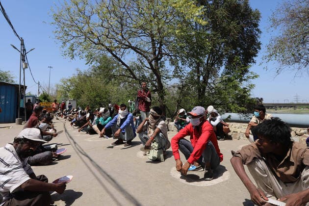 April 4, 2020, Delhi, India: Daily wage workers and homeless people in queue at a social distance while waiting for food outside a government-run night shelter during the nationwide lockdown..Indian Government imposed a 21-day nationwide lockdown to minimise the spread of coronavirus disease Delhi India - ZUMAs197 20200404_zaa_s197_138 Copyright: xAmarjeetxKumarxSinghx