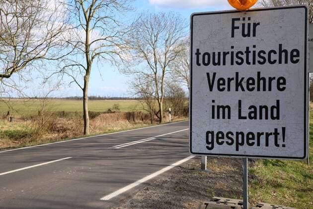 No longer looking at the sea View on Saturday 04 04 2020 in Johannishof County Vorpommern Greifswald of a sign indicating that the region of Usedom is closed to visitors from other federal states Mecklenburg Vorpommern has recently banned all tourist activities on its islands.