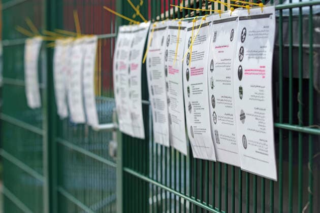 Coronavirus pandemic At the entrance of a residential accommodation for refugees and asylum seekers in Hamburg, instructions on behaviour and measures are given in several languages