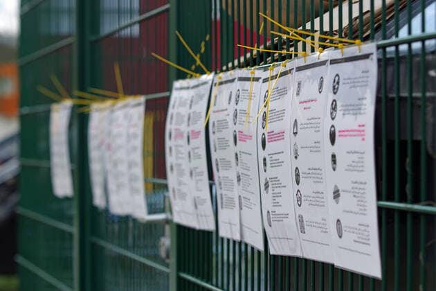 Coronavirus pandemic At the entrance of a residential accommodation for refugees and asylum seekers in Hamburg, instructions on behaviour and measures are given in several languages
