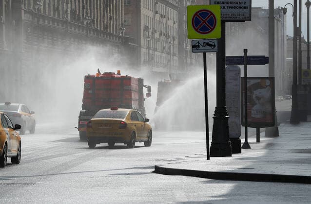 MOSCOW, RUSSIA - APRIL 5, 2020: Street sweepers washe with disinfectant the roads in Tverskaya Zastava Square as part of preventive measures against the spread of the COVID-19 infection, according to the Russian Federal Service for Consumer Protection and Welfare Supervision (Rospotrebnadzor), there are 3,893 residents diagnosed with COVID-19 in Moscow. Mikhail Tereshchenko TASS  TS0D4747