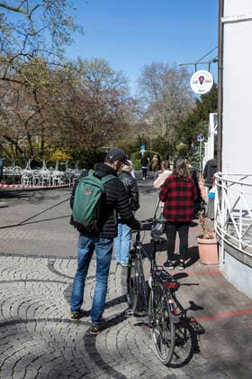 An ice cream cafe is open for sale across the street, in the best spring weather in Mülheim an der Ruhr