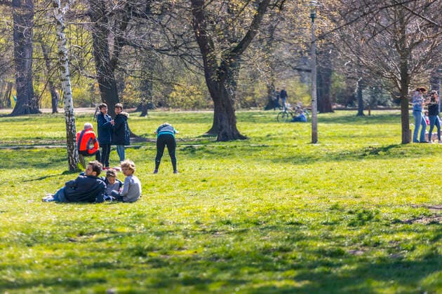 Many people enjoy the spring sun in Leipzigs Clara Zetkin Park Many keep the minimum distance, but there are exceptions