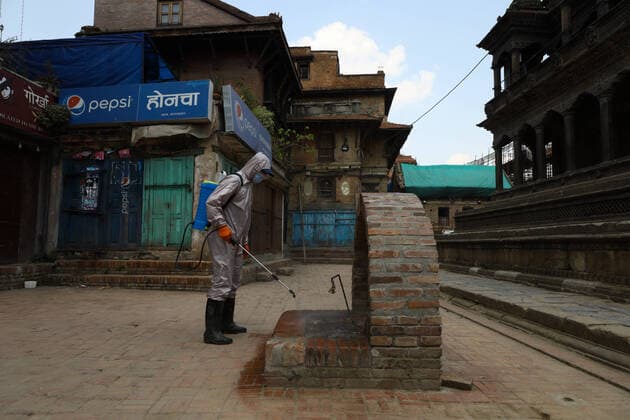 Lockdown in Nepal due to COVID-19 A Nepalese volunteer sprays disinfectants at Patan Durbar Square, a UNESCO World Heritage Site during the nationwide lockdown in Lalitpur, Nepal on Sunday, April 05, 2020. The government of Nepal has decided to impose a nationwide lockdown to prevent the spread of Coronovirus (COVID-19) outbreak. Bagmati Nepal Copyright: SubashxShrestha