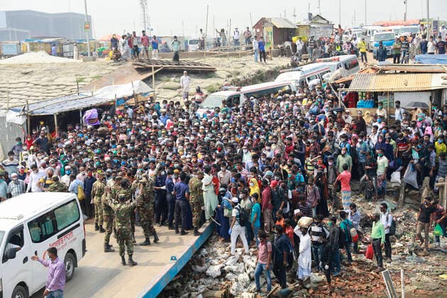 April 5, 2020, Mawa, Dhaka, Bangladesh: Thousands of readymade garment workers from across the country had either walked or used alternative modes of transpiration to reach capital Dhaka over the past few days, as owners decided to open the factories amid a government-enforced soft shutdown to prevent the novel coronavirus from spreading further. But following harsh criticisms, BGMEA was forced to keep the factories closed until April 11. The workers were told to go back home when they went to the factories to join work on Sunday morning. These photoss of people returning to their village homes were taken at the Shimulia ferry terminal in Mawa, near Dhaka, Bangladesh, April 05, 2020. Mawa Bangladesh - ZUMAd117 20200405_zap_d117_011 Copyright: xSuvraxKantixDasx