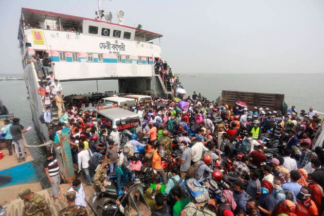 April 5, 2020, Mawa, Dhaka, Bangladesh: Thousands of readymade garment workers from across the country had either walked or used alternative modes of transpiration to reach capital Dhaka over the past few days, as owners decided to open the factories amid a government-enforced soft shutdown to prevent the novel coronavirus from spreading further. But following harsh criticisms, BGMEA was forced to keep the factories closed until April 11. The workers were told to go back home when they went to the factories to join work on Sunday morning. These photoss of people returning to their village homes were taken at the Shimulia ferry terminal in Mawa, near Dhaka, Bangladesh, April 05, 2020. Mawa Bangladesh - ZUMAd117 20200405_zap_d117_026 Copyright: xSuvraxKantixDasx