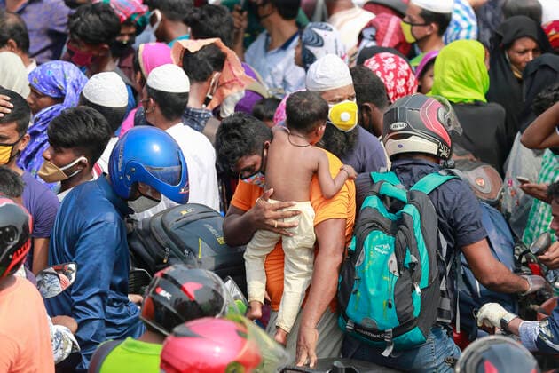 April 5, 2020, Mawa, Dhaka, Bangladesh: Thousands of readymade garment workers from across the country had either walked or used alternative modes of transpiration to reach capital Dhaka over the past few days, as owners decided to open the factories amid a government-enforced soft shutdown to prevent the novel coronavirus from spreading further. But following harsh criticisms, BGMEA was forced to keep the factories closed until April 11. The workers were told to go back home when they went to the factories to join work on Sunday morning. These photoss of people returning to their village homes were taken at the Shimulia ferry terminal in Mawa, near Dhaka, Bangladesh, April 05, 2020. Mawa Bangladesh - ZUMAd117 20200405_zap_d117_050 Copyright: xSuvraxKantixDasx