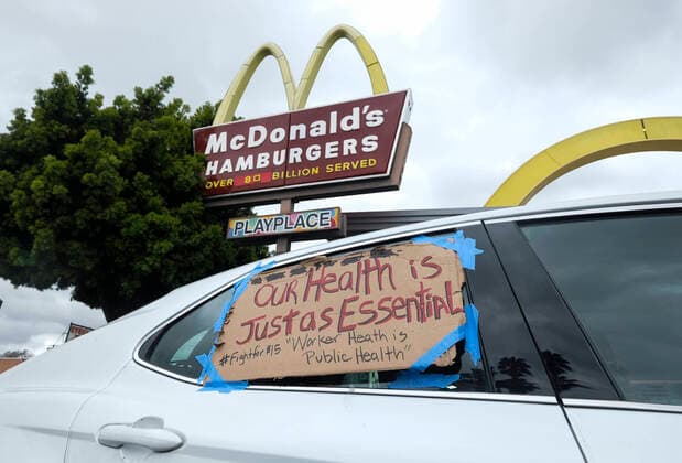 April 5, 2020, Los Angeles, California, U.S: Workers take part in a drive-thru strike at a McDonald s restaurant on Sunday, April 5, 2020 in Los Angeles. The workers are demanding a two-week quarantine period, with full pay for a co-worker who tested positive for COVID-19. Los Angeles U.S. - ZUMAc68_ 20200405_zaf_c68_002 Copyright: xRingoxChiux