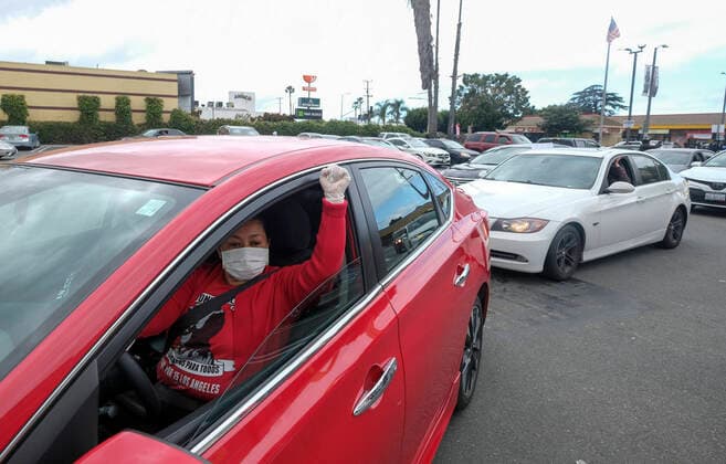 April 5, 2020, Los Angeles, California, U.S: A worker wearing a face mask and gloves takes part in a drive-thru strike at a McDonald s restaurant on Sunday, April 5, 2020 in Los Angeles. The workers are demanding a two-week quarantine period, with full pay for a co-worker who tested positive for COVID-19. Los Angeles U.S. - ZUMAc68_ 20200405_zaf_c68_007 Copyright: xRingoxChiux