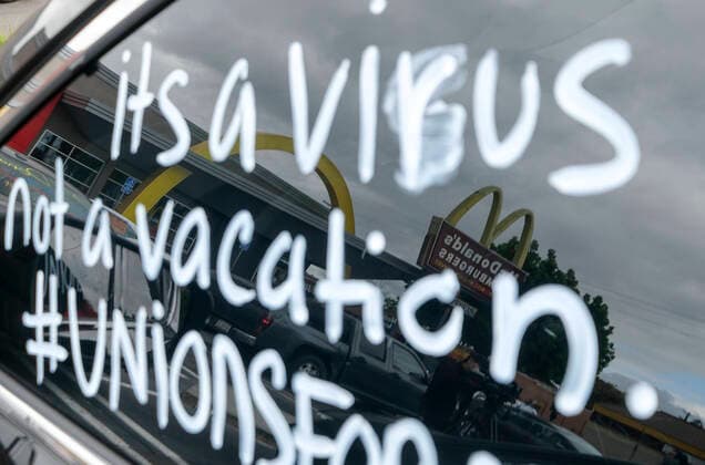 April 5, 2020, Los Angeles, California, U.S: Workers take part in a drive-thru strike at a McDonald s restaurant on Sunday, April 5, 2020 in Los Angeles. The workers are demanding a two-week quarantine period, with full pay for a co-worker who tested positive for COVID-19. Los Angeles U.S. - ZUMAc68_ 20200405_zaf_c68_012 Copyright: xRingoxChiux