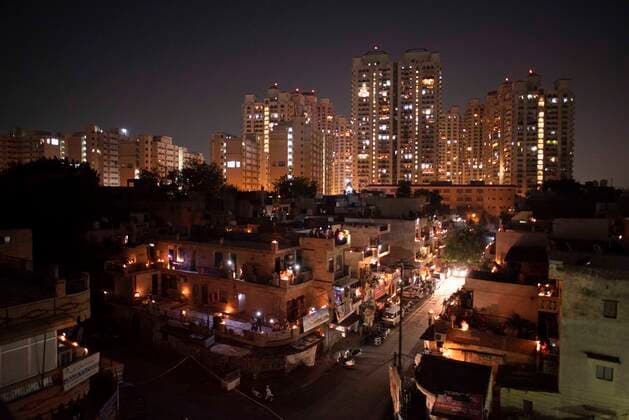 NEW DELHI, INDIA APRIL 5: People s homes lit up with candles and earthen lamps (diyas) in a show of solidarity and support for frontline workers, on day twelve of the nationwide lockdown to combat coronavirus, at Moti Nagar, on April 5, 2020 in New Delhi, India. Millions of Indians across the country switched off lights at their homes and lit candles and diyas or turned on mobile phone torches on Sunday night, responding to Prime Minister Narendra Modi s appeal to show the nation s collective resolve and solidarity in its fight against coronavirus with this symbolic gesture. (Photo by Sanchit Khanna Hindustan Times ) Millions Of Indians Light Candles, Diyas, Turn On Mobile Phone Torches After Prime Minister Modi?s Appeal