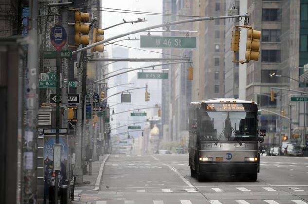 A MTA transit bus rides up an almost empty of pedestrian and automobile traffic 5th Avenue on Palm Sunday In New York City on Sunday, April 5, 2020. Cardinal Timothy Dolan today held a virtual Palm Sunday mass from St. Patrick s Cathedral. Coronavirus cases in the U.S. rose to over 300,000 and the number of deaths rose to more than 8,000 Globally the death toll has been reported at more than 65,000.  NYP20200405122 JOHNxANGELILLO