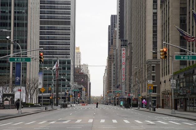 Sixth Avenue near Radio City Music Hall is almost completely empty of pedestrian and automobile traffic on Palm Sunday In New York City on Sunday, April 5, 2020. Cardinal Timothy Dolan today held a virtual Palm Sunday mass from St. Patrick s Cathedral. Coronavirus cases in the U.S. rose to over 300,000 and the number of deaths rose to more than 8,000 Globally the death toll has been reported at more than 65,000.  NYP20200405111 JOHNxANGELILLO