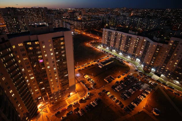 ST PETERSBURG, RUSSIA - APRIL 5, 2020: Lit windows in apartment blocks in Nevsky District. A home isolation order was declared for St Petersburg residents of all ages to restrict movement within the city and reduce the risk of coronavirus contagion, effective since March 30, 2020; a period off work with full pay was extended until April 30 nationwide as part of preventive measures to contain the spread of the COVID-19 infection. Peter Kovalev TASS  TS0D4803