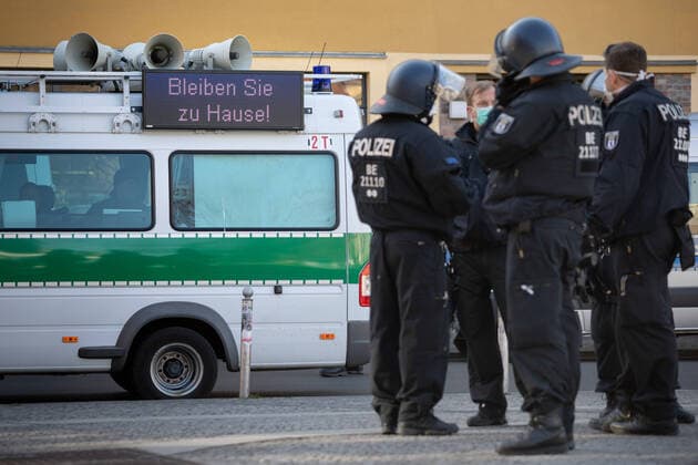 Conspiracy theorists protest gg Corona restrictions LED display panel with the inscription Stay at home on a police car at the edge of a demonstration of conspiracy theorists during the containment ordinance with exit restriction, ban on demonstrations and ban on contact to contain the COVID 19 pandemic Coronavirus SARS CoV 2 in Berlin Â Berlin Berlin Germany