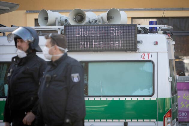 Conspiracy theorists protest gg Corona restrictions LED display panel with the inscription Stay at home on a police car at the edge of a demonstration of conspiracy theorists during the containment ordinance with exit restriction, ban on demonstrations and ban on contact to contain the COVID 19 pandemic Coronavirus SARS CoV 2 in Berlin Â Berlin Berlin Germany