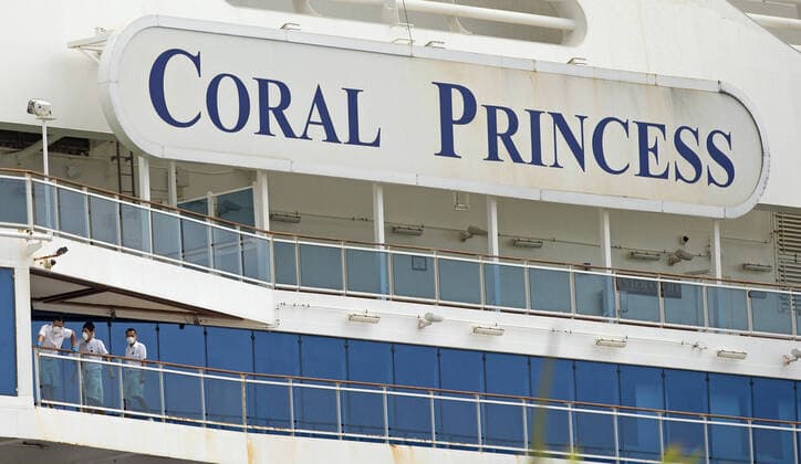 April 5, 2020, Miami, FL, USA: Coral Princess cruise crew members look from their balcony at PortMiami as the coronavirus pandemic continues on Sunday, March 5, 2020 in Miami. Miami USA - ZUMAm67_ 20200405_zaf_m67_025 Copyright: xDavidxSantiagox