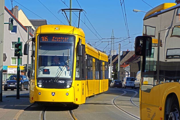 Buses and trams in the Ruhr area Buses and trams travel to the Essen transport hub at Fliegenbusch Essen North Rhine-Westphalia Germany Fliegenbusch