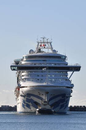 RUBY PRINCESS COVID-19 EVACUATIONS, The Ruby Princess, with crew only onboard, docks at Port Kembla, Wollongong, Monday, April 6, 2020. A criminal investigation will be launched into how cruise line operator Carnival Australia was allowed to disembark Ruby Princess passengers in Sydney, resulting in several deaths and COVID-19 outbreaks throughout the country. ( NO ARCHIVING, EDITORIAL USE ONLY, NO USE IN BOOKS WITHOUT CONSENT SYDNEY NSW AUSTRALIA Copyright: xDEANxLEWINSx 20200406001461955425