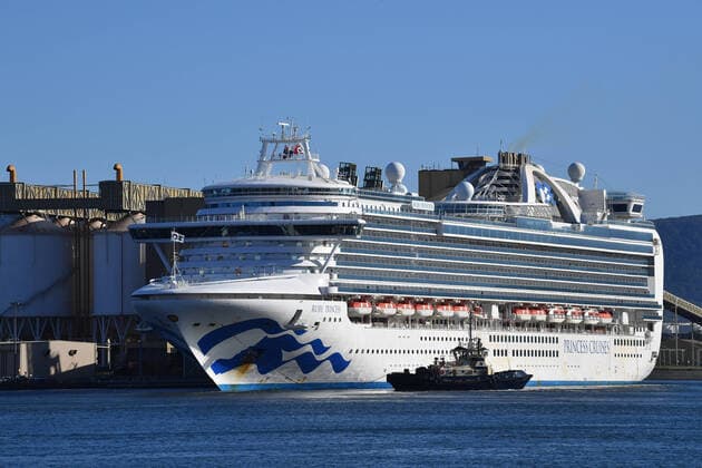 RUBY PRINCESS COVID-19 EVACUATIONS, The Ruby Princess, with crew only onboard, docks at Port Kembla, Wollongong, Monday, April 6, 2020. A criminal investigation will be launched into how cruise line operator Carnival Australia was allowed to disembark Ruby Princess passengers in Sydney, resulting in several deaths and COVID-19 outbreaks throughout the country. ( NO ARCHIVING, EDITORIAL USE ONLY, NO USE IN BOOKS WITHOUT CONSENT SYDNEY NSW AUSTRALIA Copyright: xDEANxLEWINSx 20200406001461958006