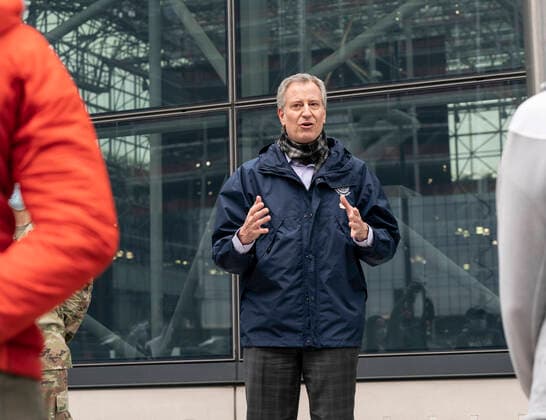Mayor Bill de Blasio welcomes medical personnel NYC Mayor Bill de Blasio speaks during welcoming ceremony for volunteer medical doctors and nurses of US Navy reserve outside of Javits Center where temporary hospital to treat patients has been set up New York New York United States Copyright: LevxRadin
