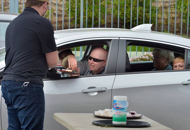 Parishioners utilize the option of a drive through to partake in the sacrament of communion-not services to kick off Holy Week despite county and state orders restricting non-essential travel at the Godspeak Calvary Chapel in the Newbury Park town of Thousand Oaks, California on Sunday, April 5, 2020. Millions of Christians around the world will spent Palm Sunday watching church service and taking communion from the comfort of their homes as they seek to abide stay-home orders intended to limit the spread of the coronavirus. File  LAP2020040511 JIMxRUYMEN