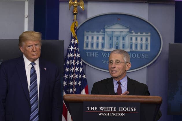 US President Donald Trumps listens to Anthony Fauci, Director of the National Institute of Allergy and Infectious Diseases, speak at the coronavirus briefing at the White House in Washington, DC on Sunday, April 5, 2020. The next two weeks will be crucial in the United States fight against the coronavirus, warn health officials, who are urging Americans to continue practicing social-distancing measures.  WAX20200405222 TASOSxKATOPODIS